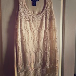 Feminine blouse with detail overlay.